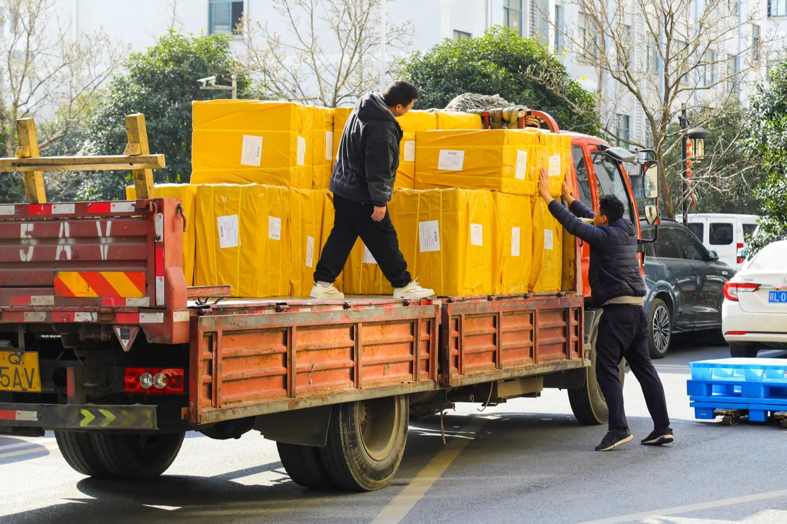 Loading cartons onto the truck for dispatch